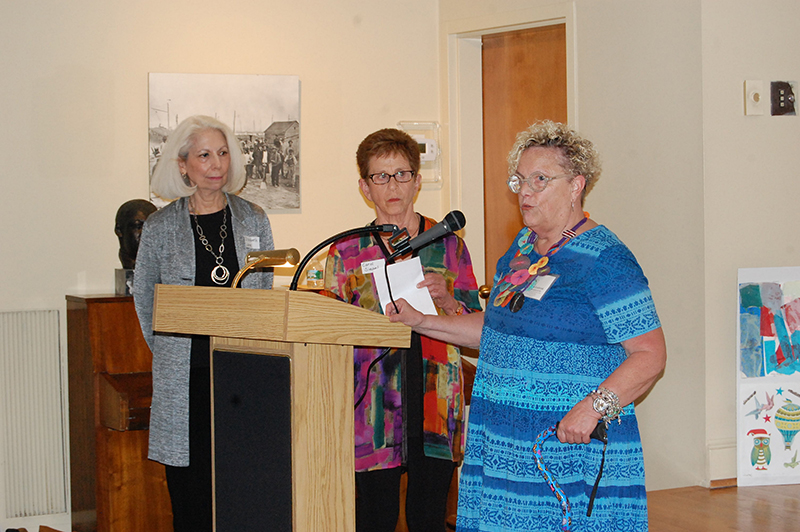 ARTIST KARLA SPEAKS TO THE GUESTS AT THE EXHIBITION OPENING WITH AFTA TEACHING ARTIST CAROL SIEGEL AND ELIZABETH LANE